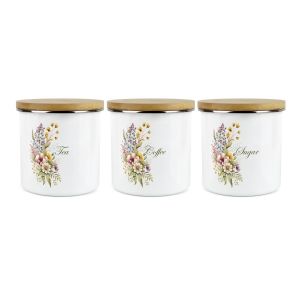 a set of three white enamel tea, coffee and sugar canisters with a floral design