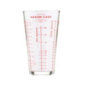 a mason cash glass cup with various cooking & baking measures
